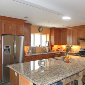 Groesbeck Construction - a kitchen with granite countertops - General Contractors Near Me