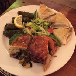 Empires - The three meze dish with: dolma, lamb musakka, and muska borek. This platter also came with bread and a small salad.