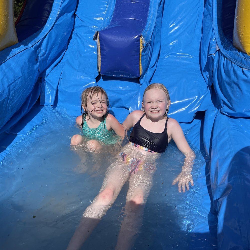 Jump Street Inflatables - My girls cooling off in the combo inflatable slide we rented. - Bounce House Rentals Near Me - Bonifay, Florida Jump Street Inflatables - My girls cooling off in the combo inflatable slide we rented. - Bounce House Rentals Near Me - Bonifay, Florida