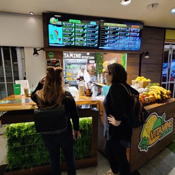 Station Vitamine - two women standing in front of a counter - Juice Bars & Smoothies Near Me - Montreal, Quebec Station Vitamine - two women standing in front of a counter - Juice Bars & Smoothies Near Me - Montreal, Quebec