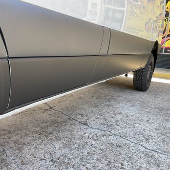 Got Signs - Close up rocker wrap with Avery satin black. - Graphic Design Near Me - Houston, Texas