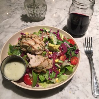 Flower Child - Grilled chicken on salad with dressing on the side. The chicken was not great. - Salad Near Me - Austin, Texas