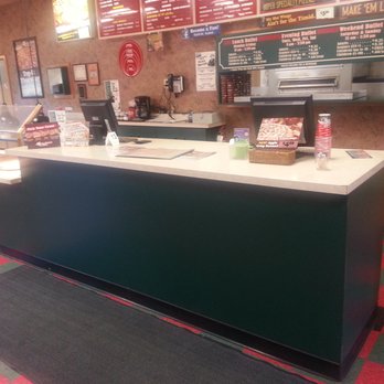 Godfather's Pizza - a checkered floor and counter - Pizza Near Me - Huron, South Dakota