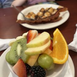 Mama Katie’s - Fruit salad, with chocolate chip pancakes and crispy bacon