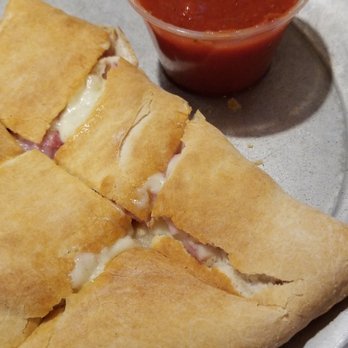 R J's Pizza - a plate of pizza and a bowl of tomato sauce - Pizza Near Me - Galax, Virginia R J's Pizza - a plate of pizza and a bowl of tomato sauce - Pizza Near Me - Galax, Virginia
