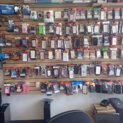 PC Cell Repair - Counter with cell phone cases.