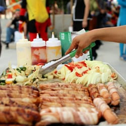 Bacon-Wrapped Hot Dog Carts - Bacon-wrapped Dogs with all the accouterments