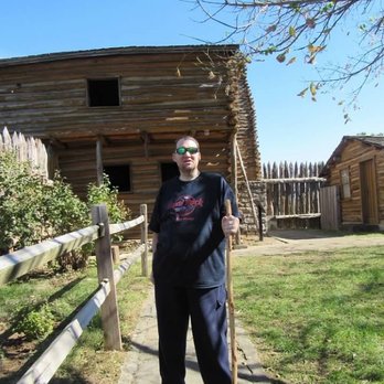 Old Fort Harrod State Park - My hubby walking down the hill towards the back of the fort. - Parks Near Me - Harrodsburg, Kentucky