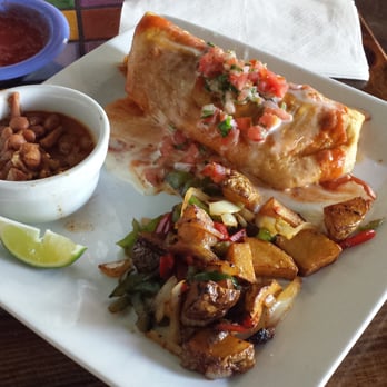 Agaves Cantina - the Seafood Chimichanga (delicious) with a side of Chorro Beans (awesome) and Mexican Potatoes (did not care for) - Mexican Near Me - Charleston, South Carolina Agaves Cantina - the Seafood Chimichanga (delicious) with a side of Chorro Beans (awesome) and Mexican Potatoes (did not care for) - Mexican Near Me - Charleston, South Carolina