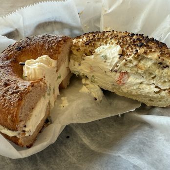 Latham Bagel Shop - Jalapeno cheddar bagel on left and garlic on the right both toasted with veggie cream cheese - Bagels Near Me - Latham, New York