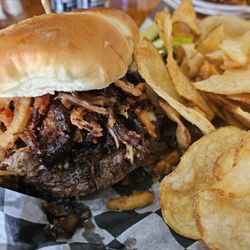 Beckett's Burger Bar - Korean BBQ Burger is topped with gochujang pork, fried onion straws, and pepperjack cheese.