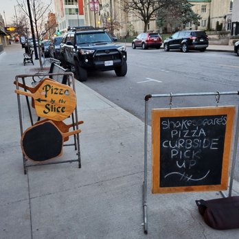 Shakespeare's Pizza - Downtown - a chalkboard sign on the sidewalk - Pizza Near Me - Columbia, Missouri Shakespeare's Pizza - Downtown - a chalkboard sign on the sidewalk - Pizza Near Me - Columbia, Missouri