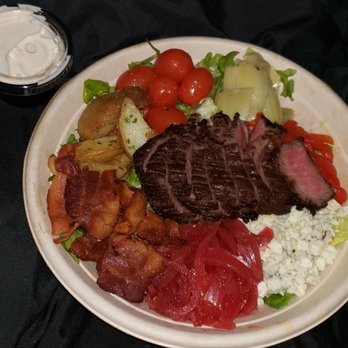 PDQ Test Kitchen - Tuscany Bowl -"Arugula blend & basmati rice topped with sous vide steak, garlic potatoes,  artichokes & gorganzola dressing". $12.99 - American Near Me - Tampa, Florida