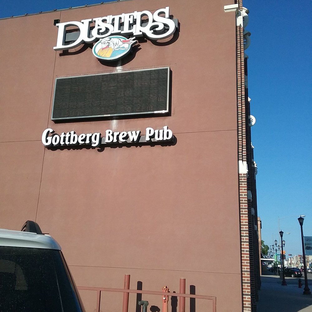 Dusters - a car parked in front of a building - American Near Me - Columbus, Nebraska Dusters - a car parked in front of a building - American Near Me - Columbus, Nebraska