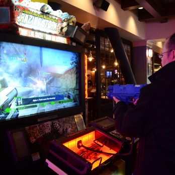 GameWorks - a man playing a video game - Arcades Near Me - Seattle, Washington GameWorks - a man playing a video game - Arcades Near Me - Seattle, Washington