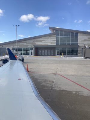 Photo of Alpena County Regional Airport - Alpena, MI, US. Terminal building from the plane.