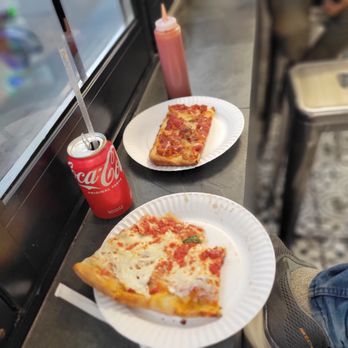 3 Bros Pizza - two slices of pizza on paper plates - Pizza Near Me - Astoria, New York 3 Bros Pizza - two slices of pizza on paper plates - Pizza Near Me - Astoria, New York