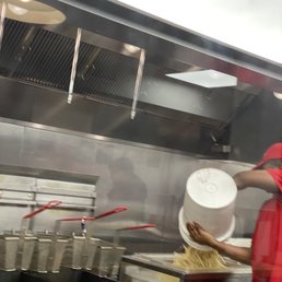 No gloves and handling a bucket with frozen fries. No gloves and handling a bucket with frozen fries.