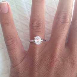 1.5 carat oval solitaire with 14 carat white gold band (1.7 mm width)