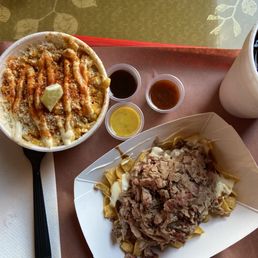 Elotes (Mexican street corn). Frito pie with pulled pork and pinto beans.