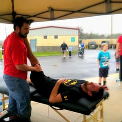 Florida Wellness Medical Group - Dr. Brandon stretching runners before the 5k