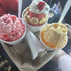 Strawberry banana delight, mango and tiger blood shaved ice with condensed milk and ice cream.