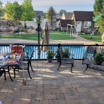 Odyssey Pools - a patio with a table and chairs - Pool & Hot Tub Service Near Me - Draper, Utah Odyssey Pools - a patio with a table and chairs - Pool & Hot Tub Service Near Me - Draper, Utah