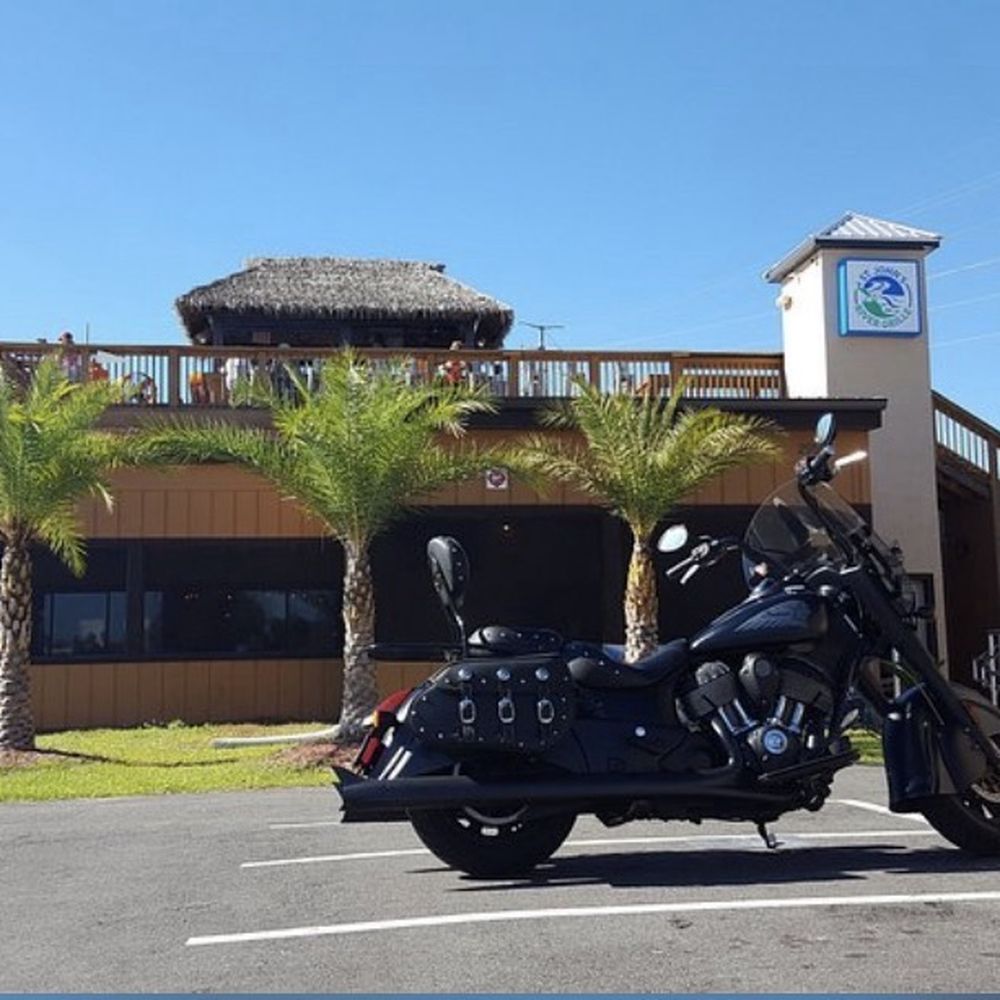 St John's River Grille - This is the outside of the building where you park he can go up that very top part or the very lower part has or you can take your dog in - New American Near Me - DeLand, Florida St John's River Grille - This is the outside of the building where you park he can go up that very top part or the very lower part has or you can take your dog in - New American Near Me - DeLand, Florida