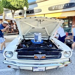 The Village Glendora - showcases a true piece of American automotive history with this beautiful 1964 1/2 Ford Mustang. The classic white fresh paint