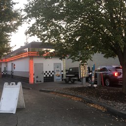 a car parked in front of a gas station