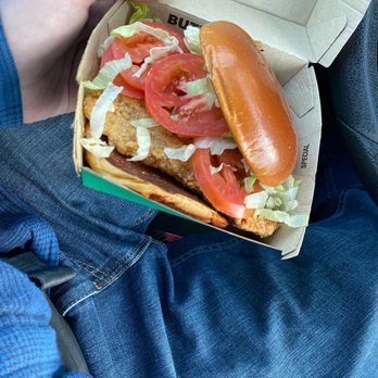 McDonald's - a person holding a hot dog in a box - Fast Food Near Me - Dupont, Washington McDonald's - a person holding a hot dog in a box - Fast Food Near Me - Dupont, Washington