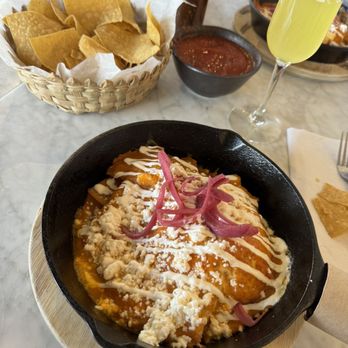 Taqueria Jalisco - ANIA - Chilaquiles rojos, chips and salsa and mimosa. - Mexican Near Me - Chattanooga, Tennessee