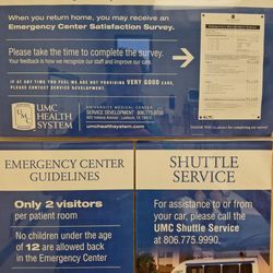 UMC Health System - Signs on the door, including a phone number for help with bad service.