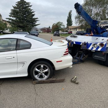 Bora Towing - Driver first hooking up the car to get it back to my garage - Towing Near Me - Edmonton, Alberta Bora Towing - Driver first hooking up the car to get it back to my garage - Towing Near Me - Edmonton, Alberta