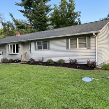 Francisco Landscaping - the front of a home with a lawn mower in front of it - Landscaping Near Me