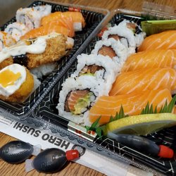 Hero Sushi - One of many salmon boxes on the right. And cute fish shaped soy sauce!
