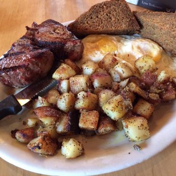 Crow's Nest - The best of breakfasts: steak, eggs, and potatoes accompanied by the perfect touch of sweet thanks to the house-made zucchini toast. - Breakfast & Brunch Near Me - Kalamazoo, Michigan Crow's Nest - The best of breakfasts: steak, eggs, and potatoes accompanied by the perfect touch of sweet thanks to the house-made zucchini toast. - Breakfast & Brunch Near Me - Kalamazoo, Michigan