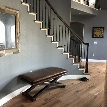 Floor Store - a wooden bench in front of a staircase - Flooring Near Me - Chatsworth, California