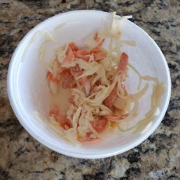 a bowl of food on a counter a bowl of food on a counter