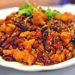 Spicy House - La Zi Ji is crispy outside, tender inside, with dried chili aroma and sesame. Spicy, flavorful, and addictive with each bite.