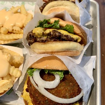 Shake Shack Downtown Crossing - a tray of burgers and macaroni and cheese fries - Burgers Near Me - Boston, Massachusetts Shake Shack Downtown Crossing - a tray of burgers and macaroni and cheese fries - Burgers Near Me - Boston, Massachusetts