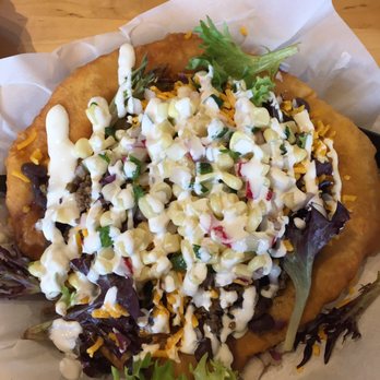 Tocabe An American Indian Eatery - Fry bread with lettuce, ground bison, black beans, corn salsa, and sour cream. - American Near Me - Denver, Colorado Tocabe An American Indian Eatery - Fry bread with lettuce, ground bison, black beans, corn salsa, and sour cream. - American Near Me - Denver, Colorado
