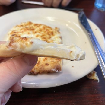 Pizza West - You can see the layer of gooey dough. - Pizza Near Me - Omaha, Nebraska