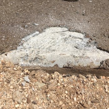 OC Concrete Stain - I chipped away a section with a chisel to see how hard it is going to be to remove the overlay. Less than 1/4" - Masonry/Concrete Near Me OC Concrete Stain - I chipped away a section with a chisel to see how hard it is going to be to remove the overlay. Less than 1/4" - Masonry/Concrete Near Me