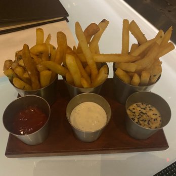 Stripsteak - Fries with difference sauces. The garlic ketchup was the best. - Steakhouses Near Me - Las Vegas, Nevada Stripsteak - Fries with difference sauces. The garlic ketchup was the best. - Steakhouses Near Me - Las Vegas, Nevada