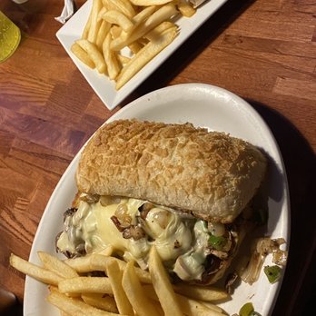 Buzz Inn Steakhouse - Philli cheese steak with a garlic toasted bread. And the chicken Caesar wrap. - Steakhouses Near Me - Ellensburg, Washington