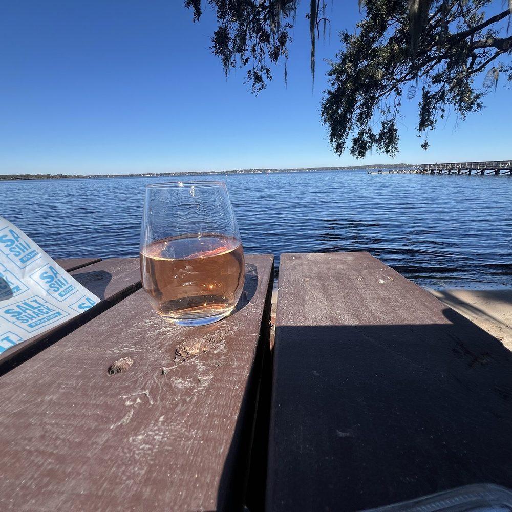 Salt Shack - Rosé pairs perfectly with this scenery. - Seafood Near Me - Clermont, Florida Salt Shack - Rosé pairs perfectly with this scenery. - Seafood Near Me - Clermont, Florida