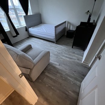 Galo Flooring - a living room with a couch and a bed - Flooring Near Me - Cherry Hill, New Jersey