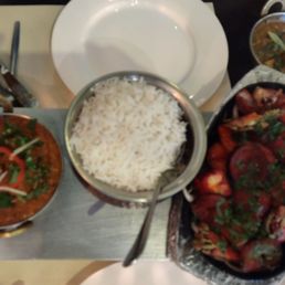 Lamb vindaloo, rice and mixed vegetables with aloo partha. Lamb vindaloo, rice and mixed vegetables with aloo partha.