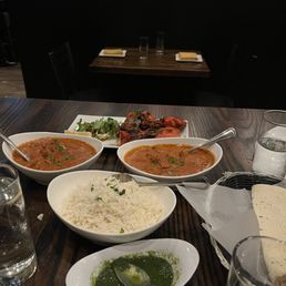 Chicken tikki masala, rice, tandoori chicken and sauces.